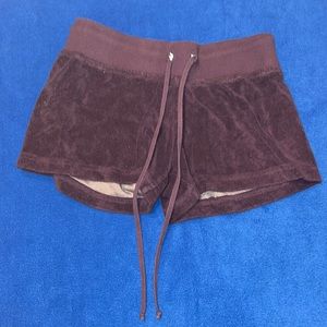Women’s size medium dark purple hard tail shorts longer length